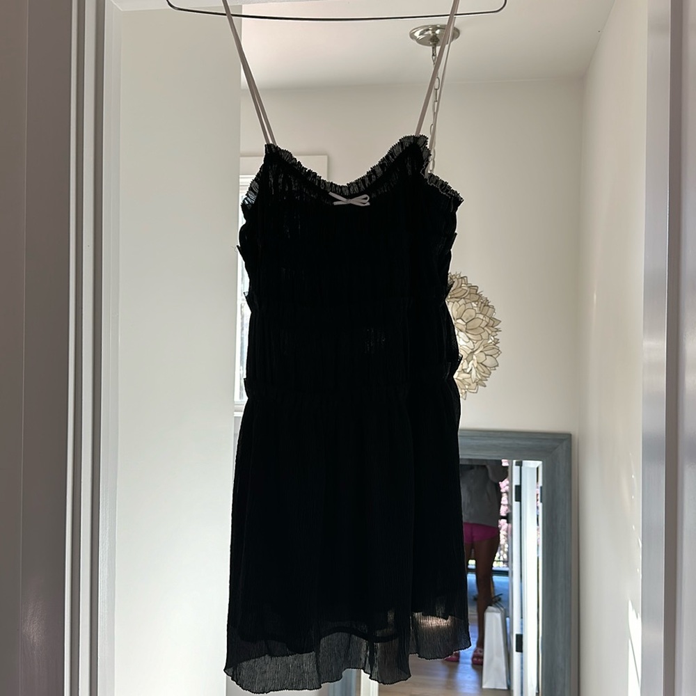 Adorable black dress from Zara size small. Little bow textured dress.
